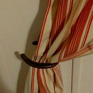 Western curtain rod holders and tie backs